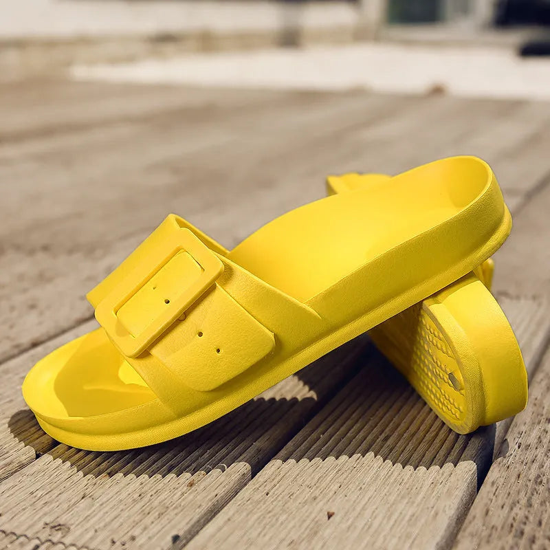Women's grey blue EVA flip-flop sandals with a buckle strap on a white background.