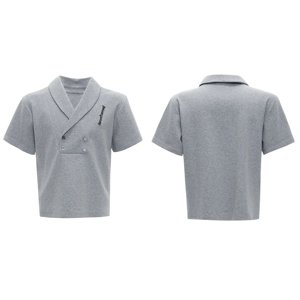 Men's dark grey V-neck padded shoulder short sleeve jacket with metal embellishments and matching shorts.