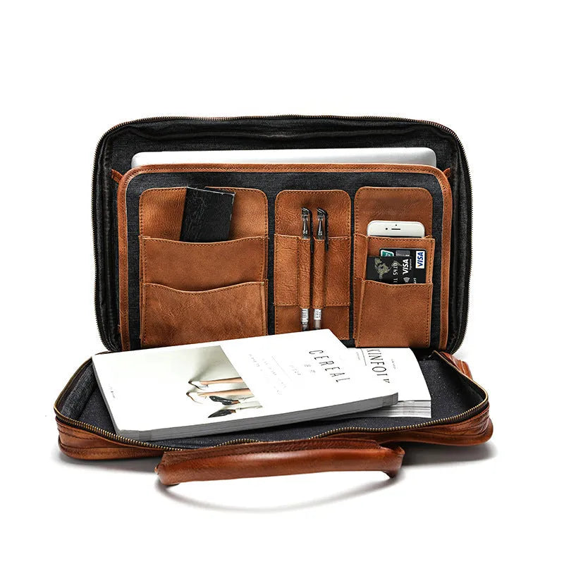Brown vintage men's leather briefcase open to show internal laptop, document, and camera pockets.