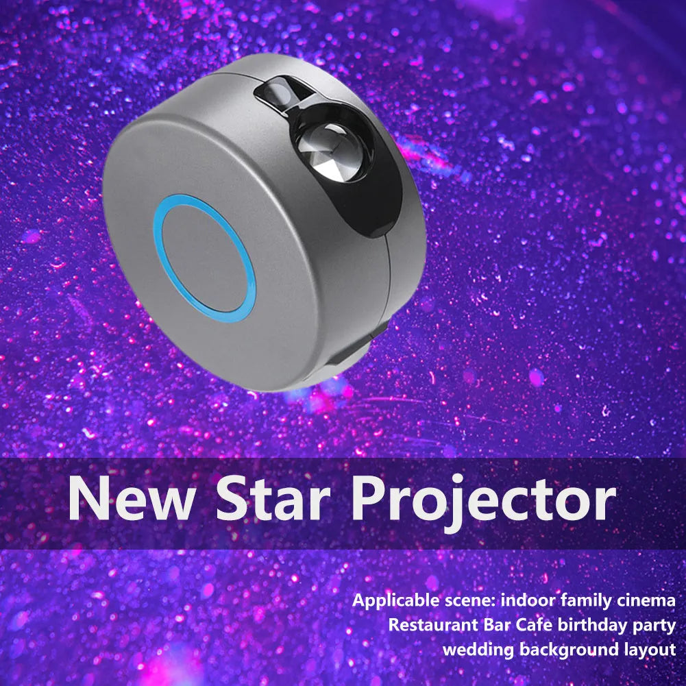 Grey starry sky projection lamp with remote control projecting coloured stars and green laser light indoors.