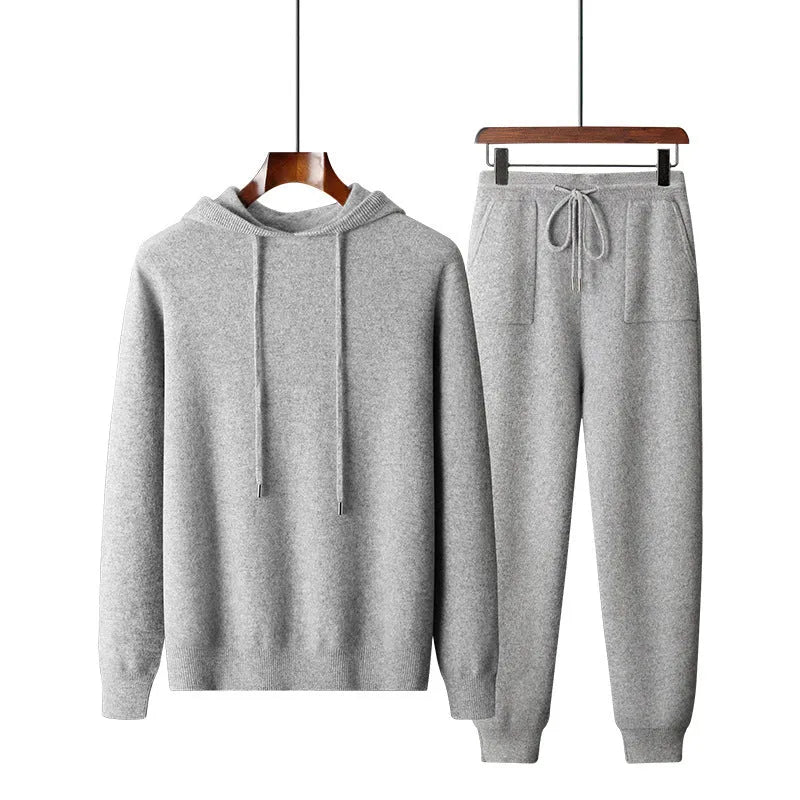 Men's light grey cashmere hooded sweatshirt and trouser set laid flat