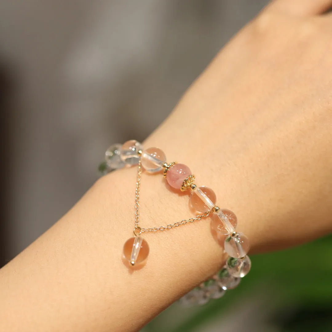 White and pink cat eye obsidian crystal bracelet with geometric Chinese patterns
