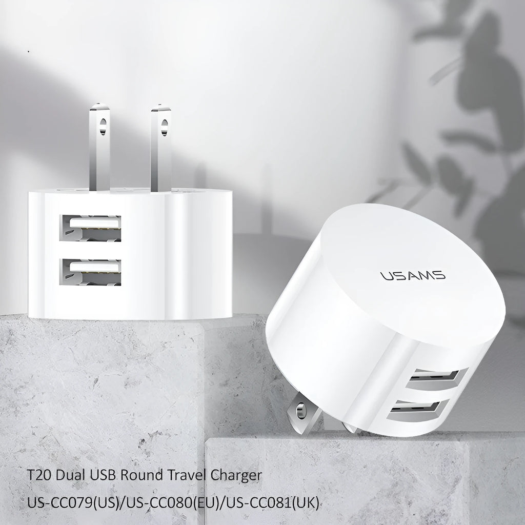 White portable universal dual USB phone charger with UK, EU, and US plugs