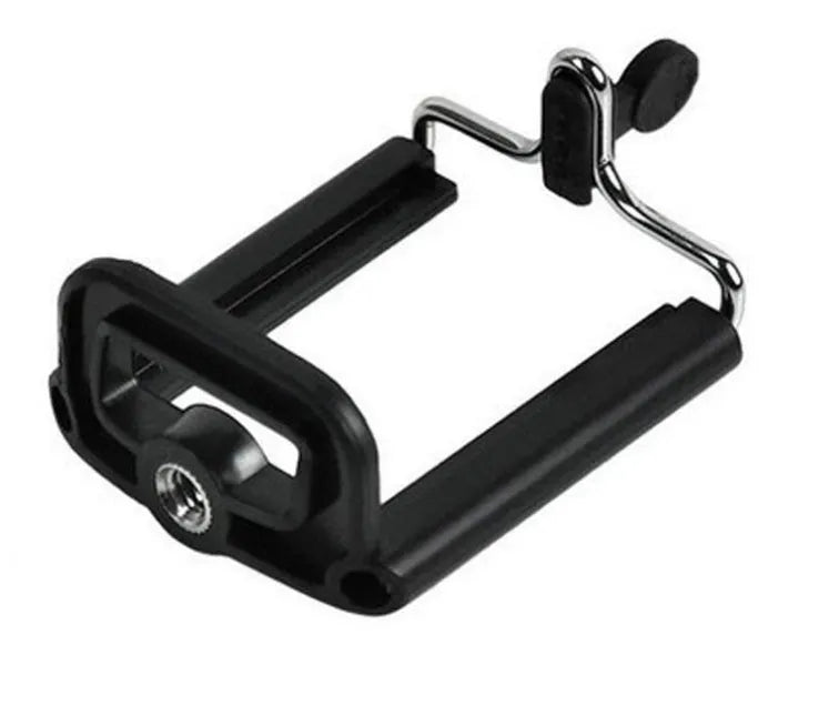 Mini aluminium tripod extended with ball head, shown alongside a U-shaped smartphone clip on a table.