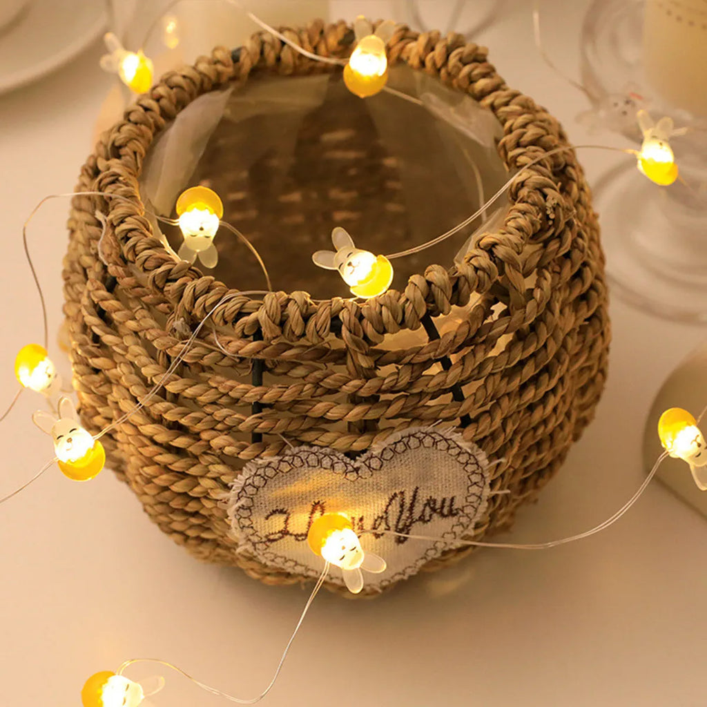 Easter LED bunny string lights with carrot and white rabbit bulbs on a dark background