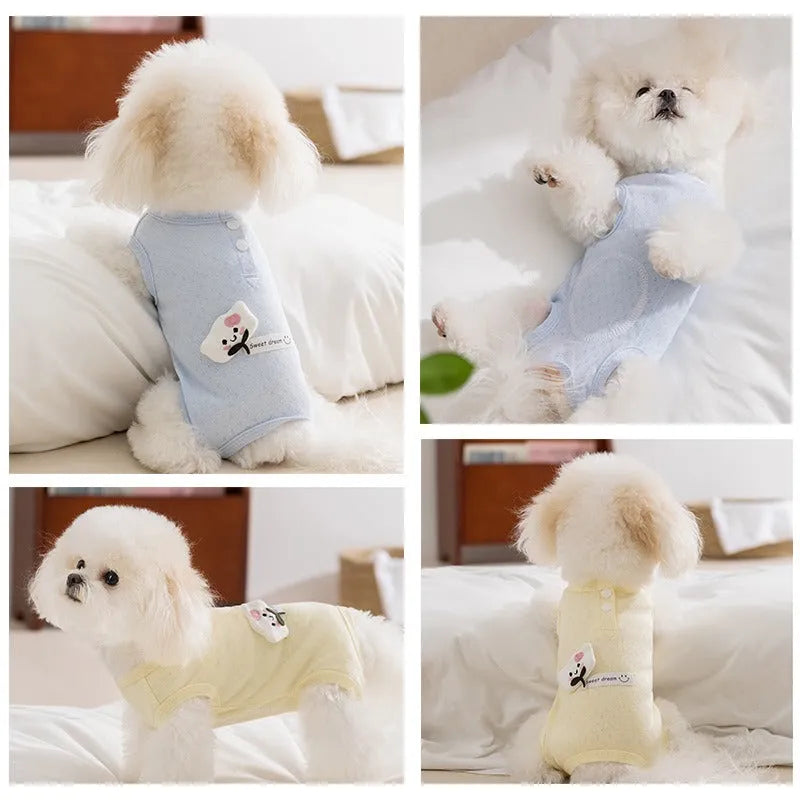 Pet shirt in soft yellow mesh fabric with cat patches and button closure on white background