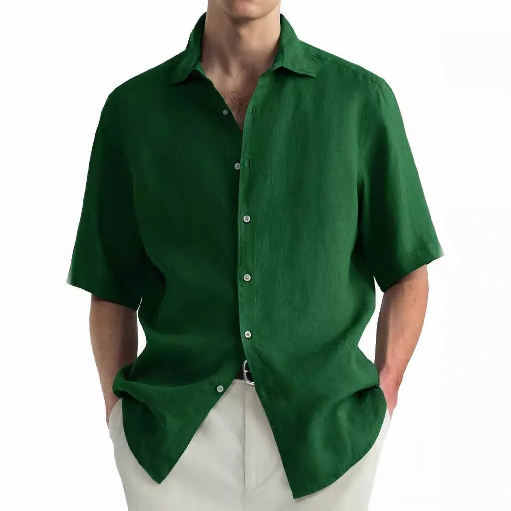 A man wearing a green washed cotton casual shirt in a cardigan style with a regular fit.