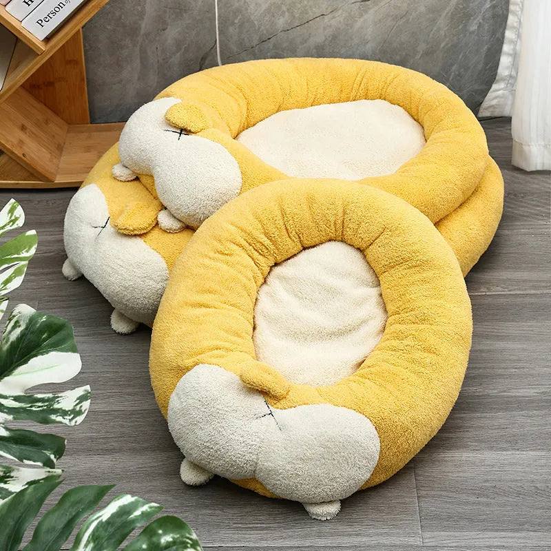 Corgi shaped plush pet bed for dogs and cats with raised edges.