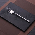 Stainless steel cutlery set with main knife, main fork, main spoon, and teaspoon in silver finish