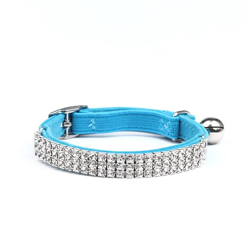 Velvet cat collar with rhinestones in red, blue, purple, black, or pink, showing adjustable buckle.