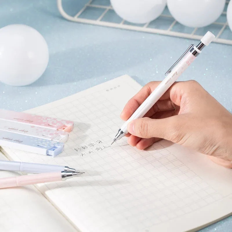 Sakura law cartoon style automatic pencil set with three coloured pencils and boxes of 0.5mm HB refills.