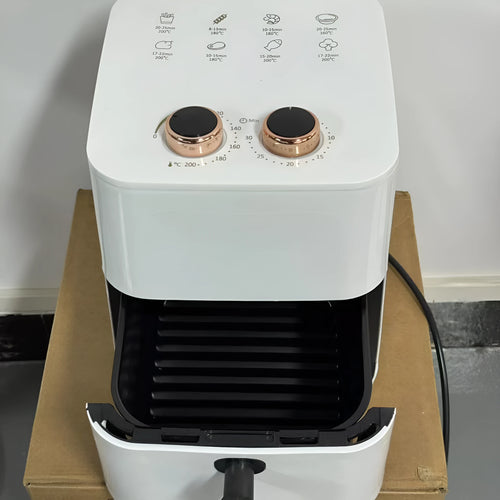 Black digital air fryer with touch screen and 5.5L basket on kitchen countertop