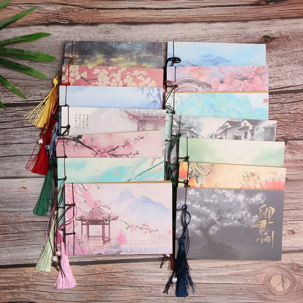 A5 kraft paper notebook with hand-stitched binding and a leather tassel, showing natural cover colour.