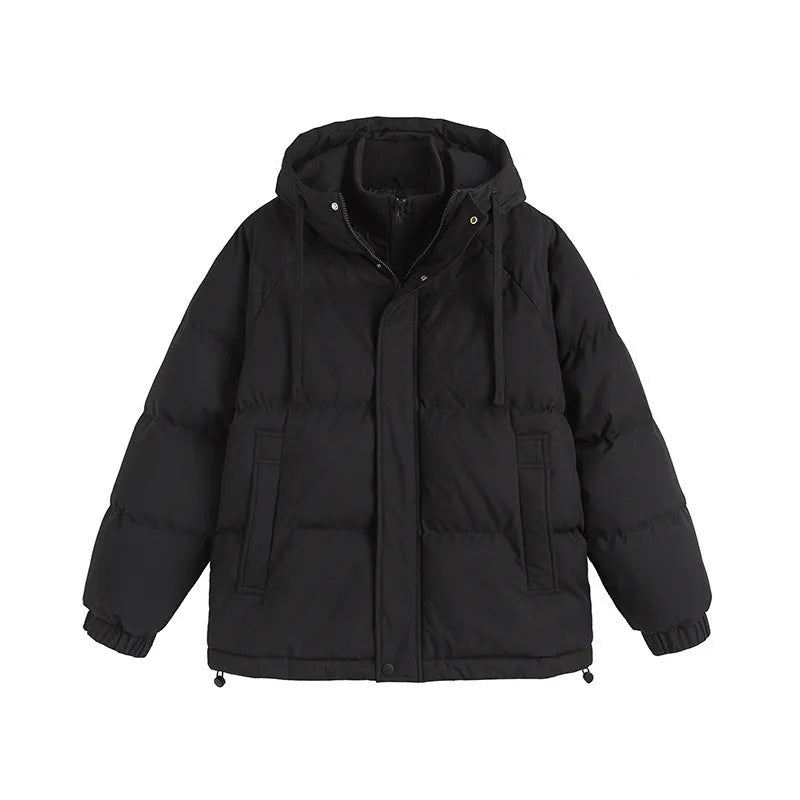 A loose, longline beige cotton-padded winter coat for men and women with side seam pockets.
