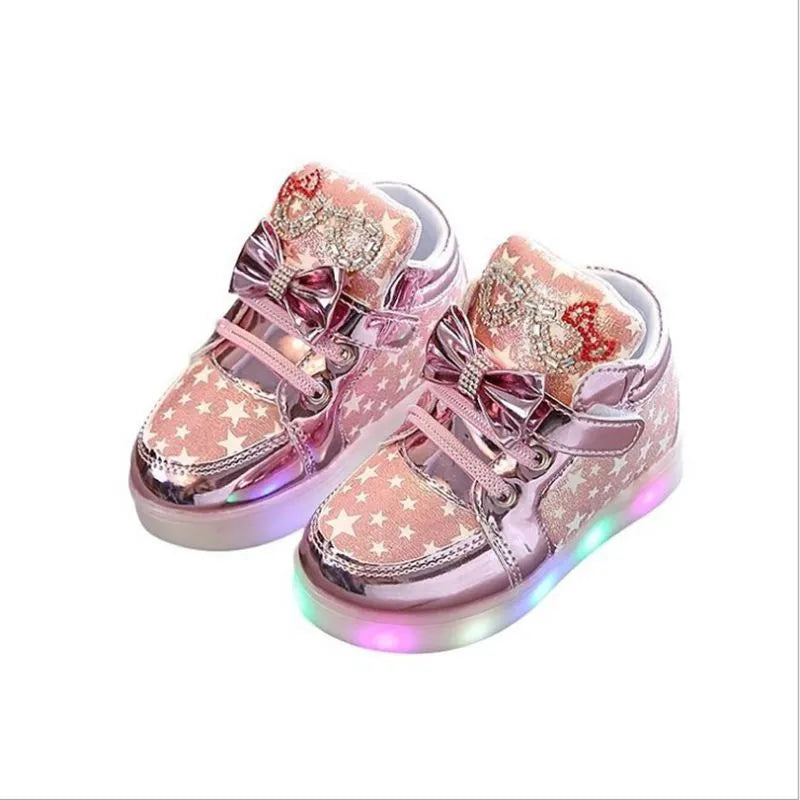 Children's LED magic button shoes with flashing lights in golden, pink, and silvery colours.