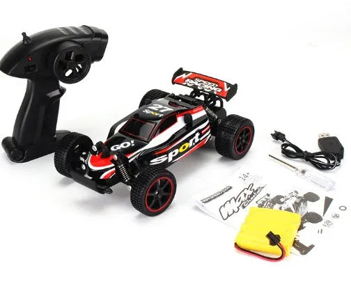 Blue 1:18 scale remote control off-road drift car with 2.4GHz remote on a grey surface.