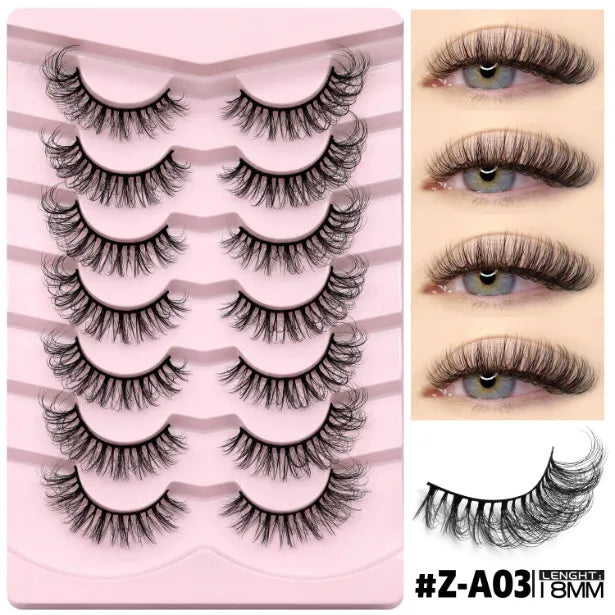 Box of black artificial fibre false eyelashes in a natural thick style with a tube of adhesive glue.