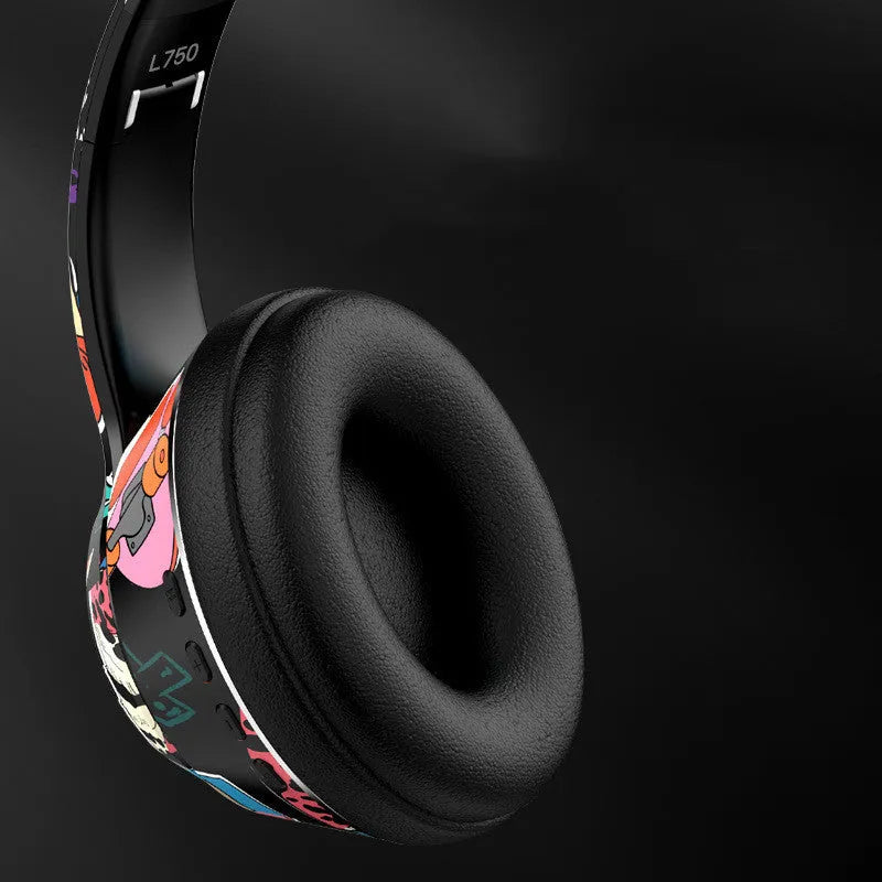 Graffiti wireless Bluetooth headset in black and white colours, shown with features like NFC and wireless charging.