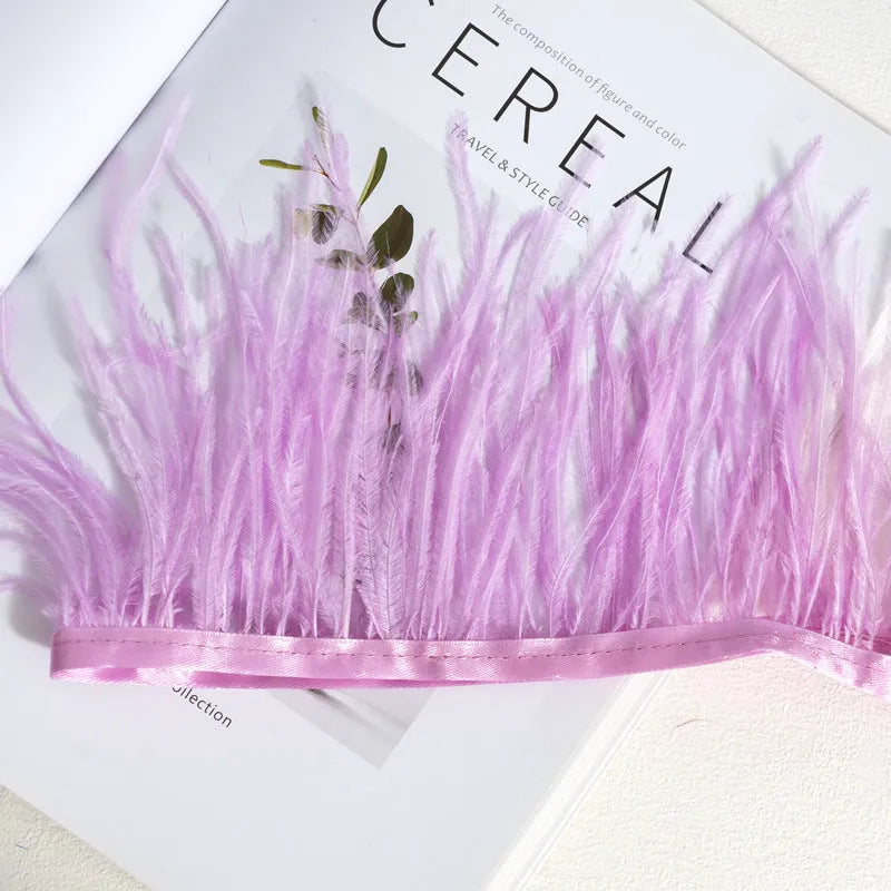Decorative feather cloth strip in multiple colours including white, black, and mint green for DIY clothing and craft projects