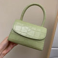 Leather handbag with hard handle, horizontal square shape, 17.5 cm x 7 cm x 11 cm, cover type, in black, blue or light green.