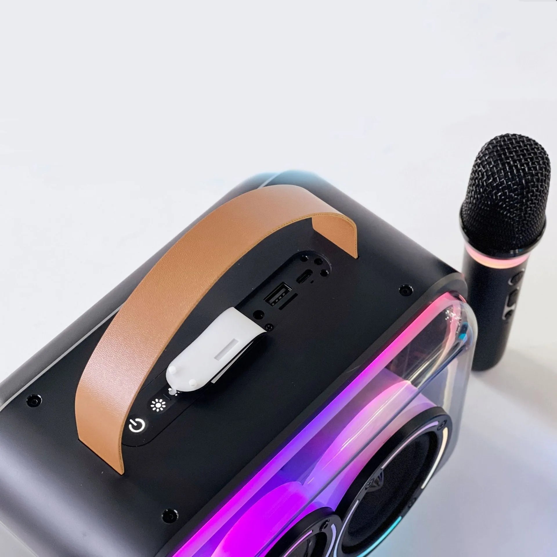 Portable Bluetooth karaoke speaker with colourful RGB lights showing black or light yellow colour options