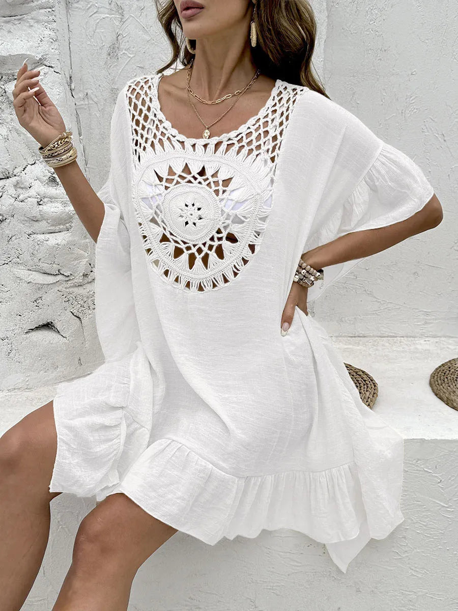 Crochet stitching detail on tassel-trim patchwork skirt beach cover-up dress in apricot colour.