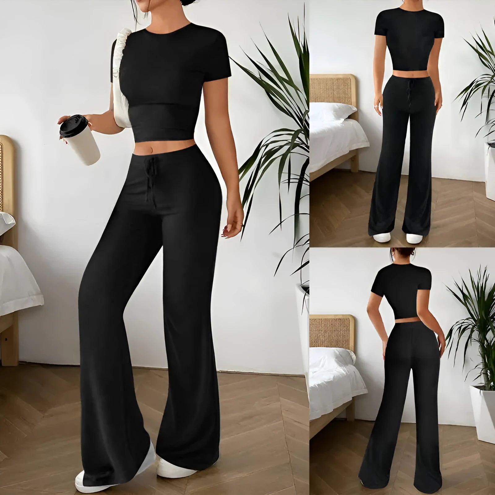 A woman's black high-waist trousers and matching short-sleeve T-shirt co-ord set laid flat.