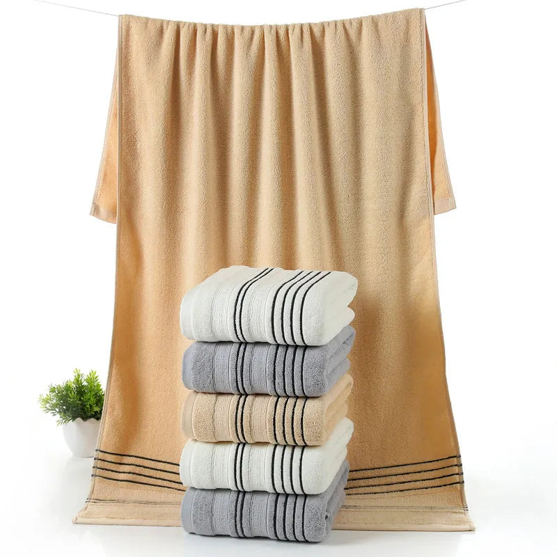 Pure cotton bath towel set showing one large bath towel and two smaller hand towels in matching colour