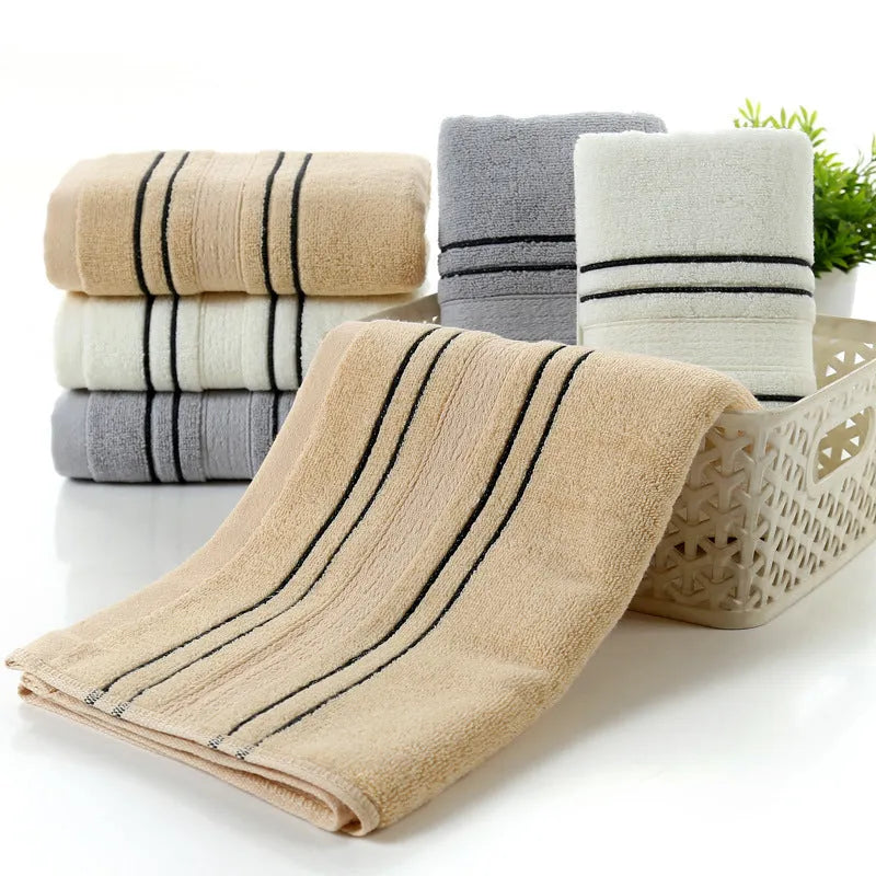 Pure cotton bath towel set showing one large bath towel and two smaller hand towels in matching colour