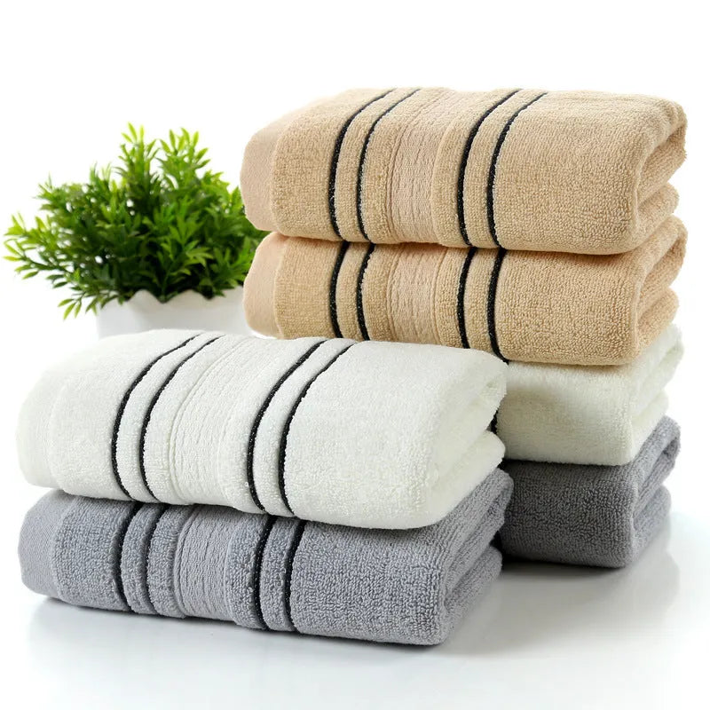 Pure cotton bath towel set showing one large bath towel and two smaller hand towels in matching colour