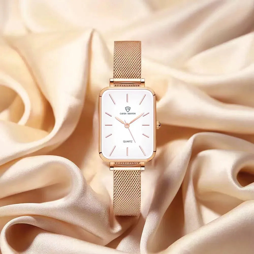 Rose gold women's quartz watch with woven steel strap on wrist, showing alloy case.