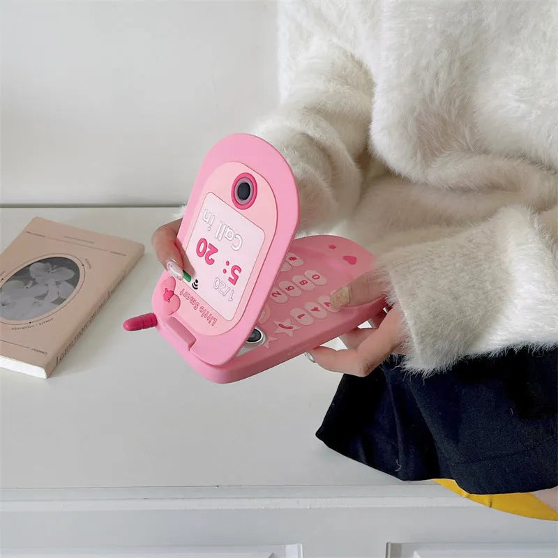 Pink silicone flip phone case with a mirror for iPhone models.