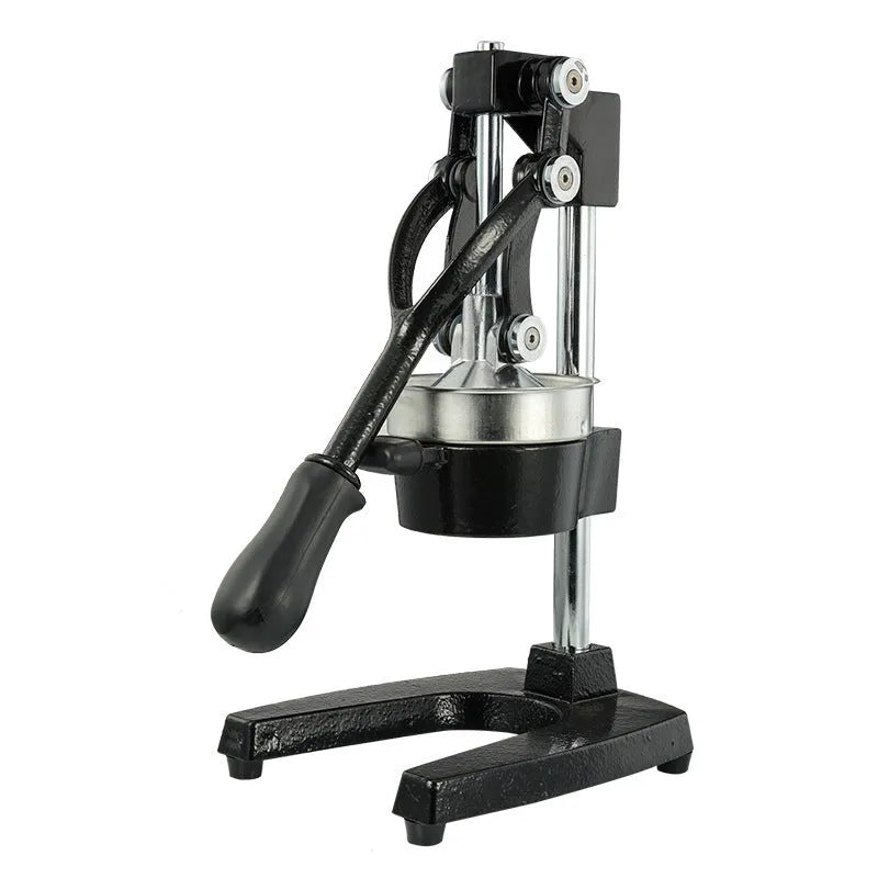A tall black cast iron manual citrus juicer with a stainless steel strainer on a kitchen counter.