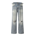 Blue men's straight-leg jeans with ripped detailing and a zip fly on a plain background.