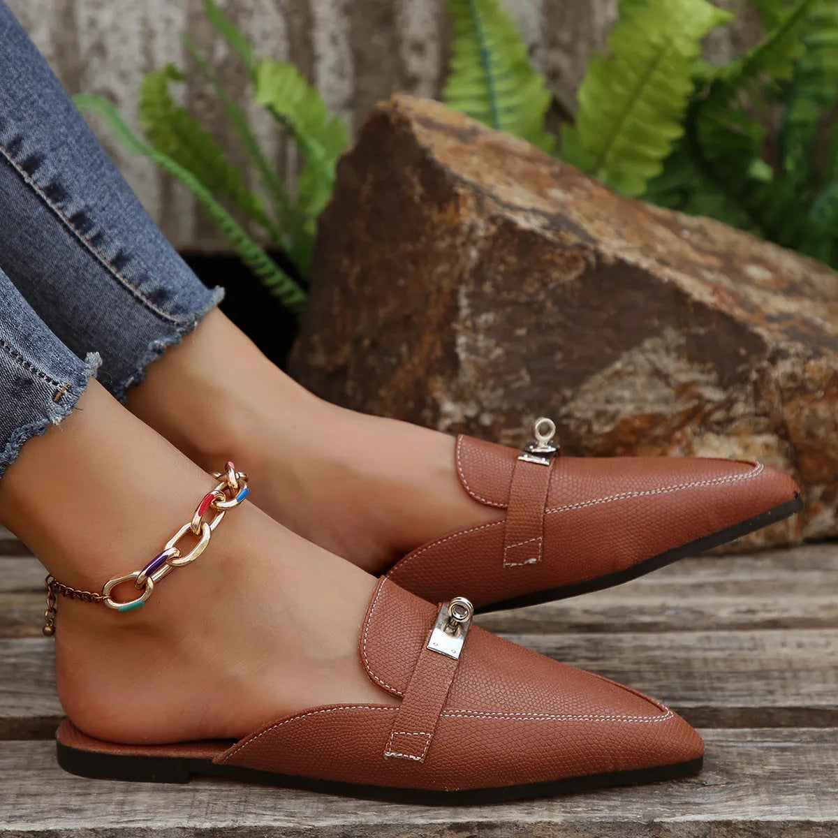 Light brown women's pointed-toe casual semi-slippers with a low heel and rubber sole.