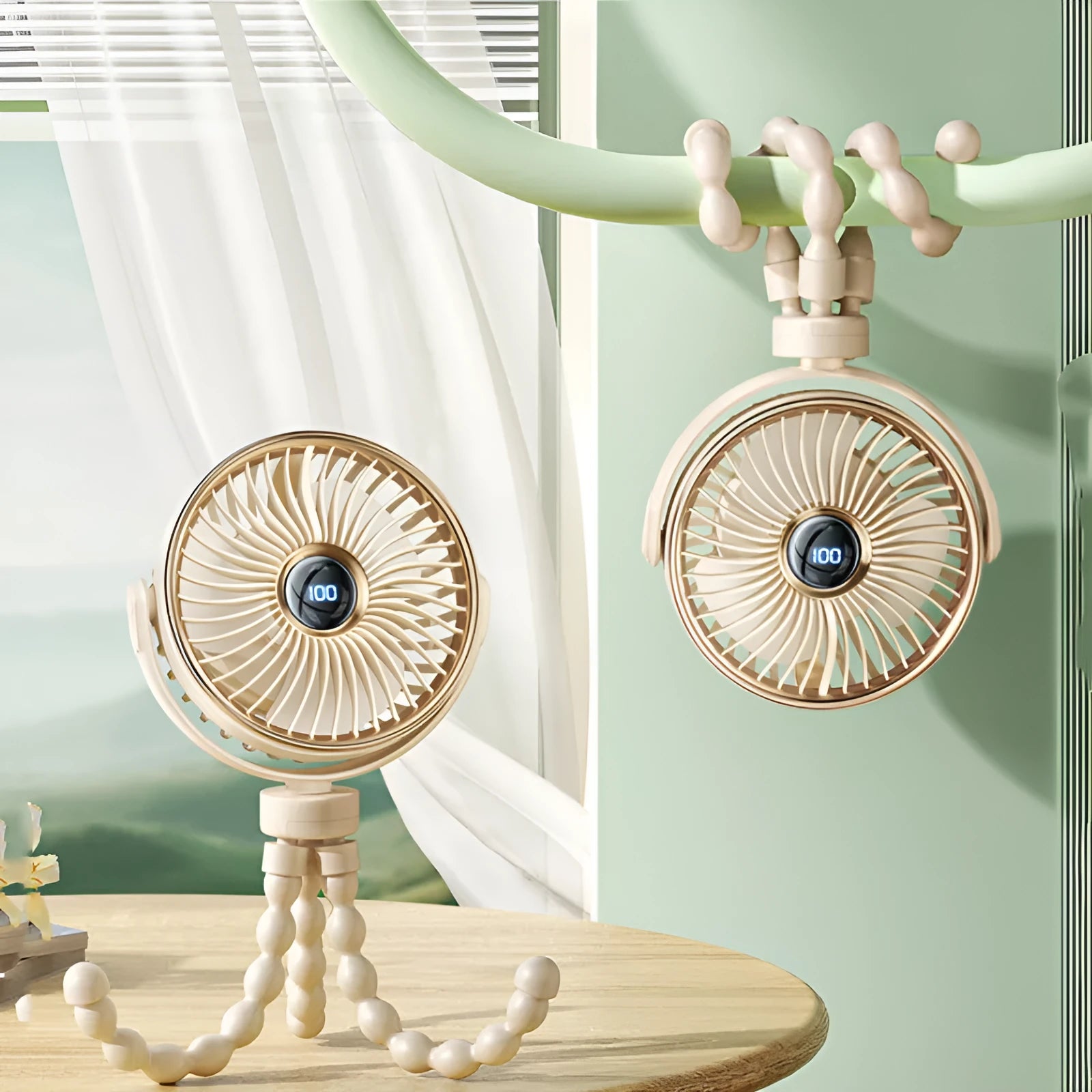 A beige portable clip-on fan with three blades, mounted on a stroller handle, showing its rotating head.