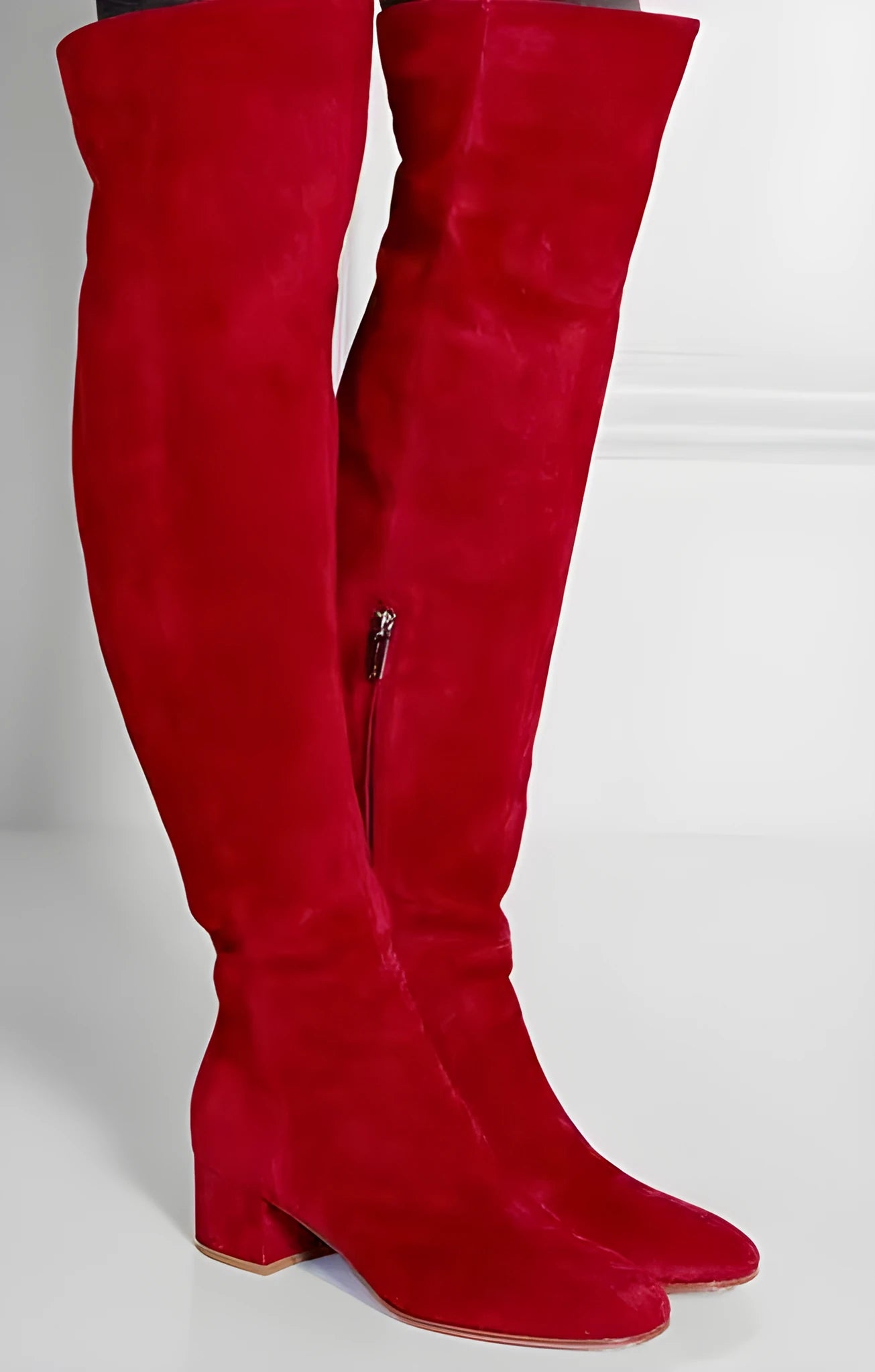 Grey suede women's flat over-the-knee boots with a pointed toe and low block heel on a white background.