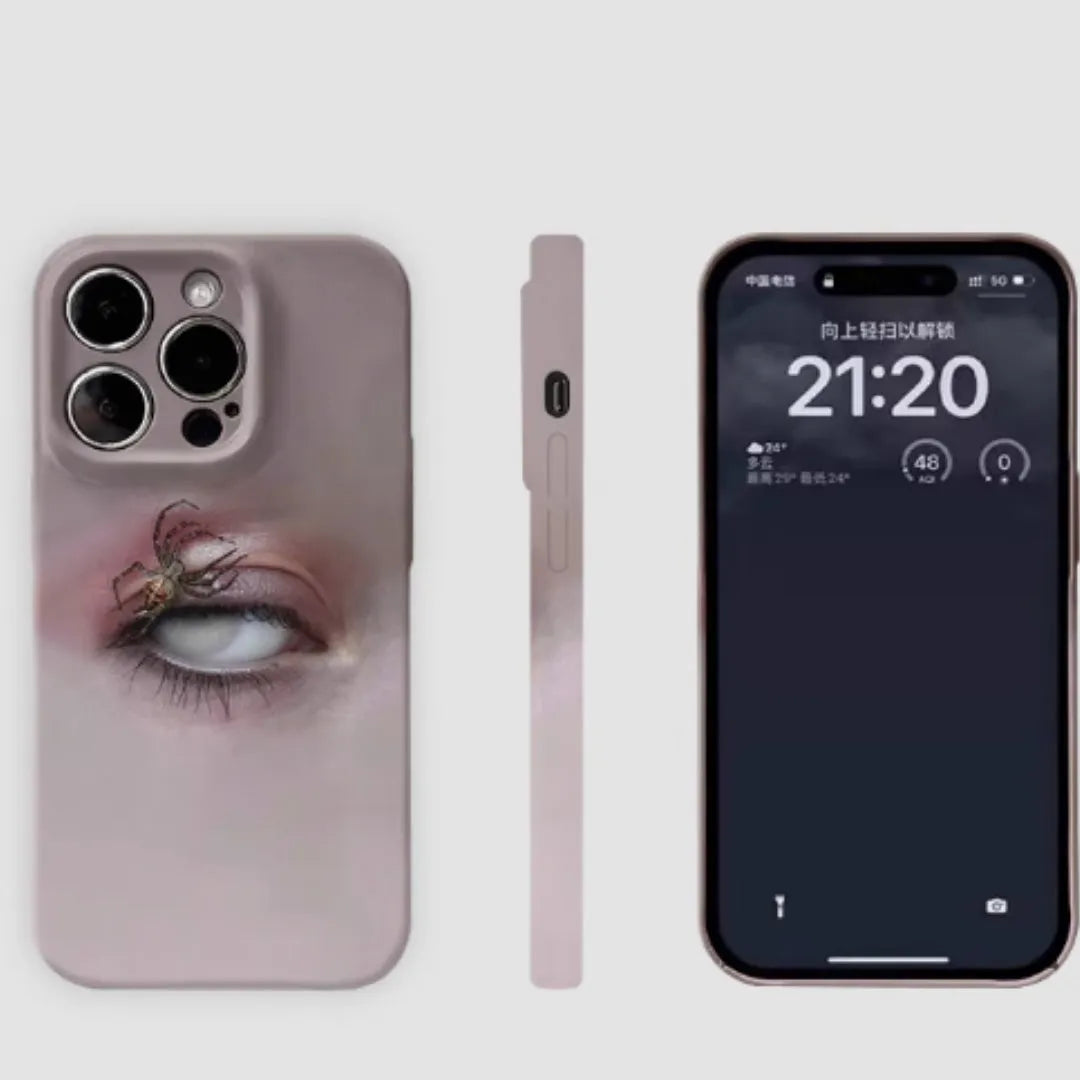 Dark frosted iPhone case with a spider web pattern, shown protecting a mobile phone.