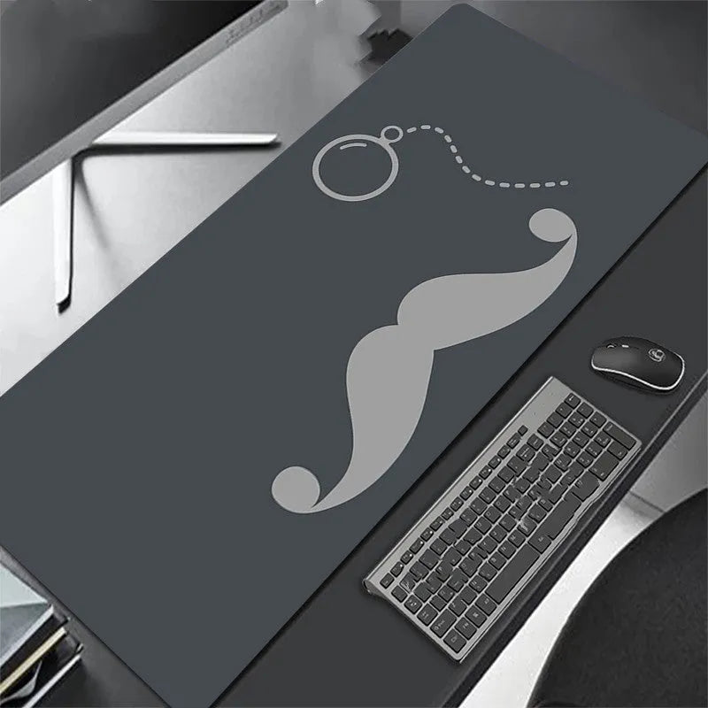 All black extra long mouse pad with precision overlock stitching on a desk