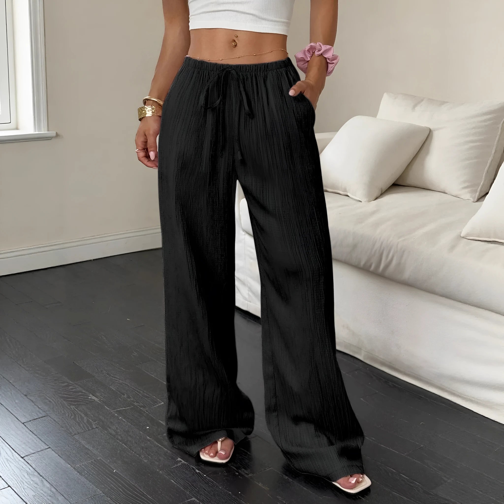 Women's black wide-leg trousers with a front lace-up waist detail on a mid-waist.