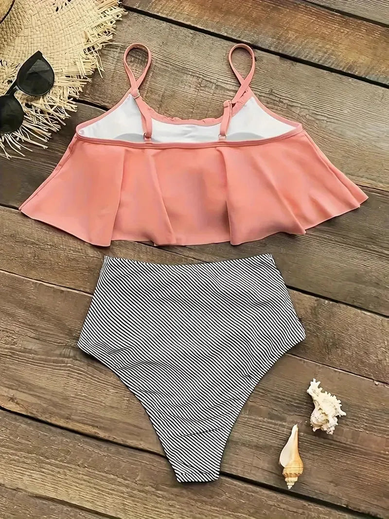 Green women's swimsuit with ruffles, high waist, and backless design on a mannequin.