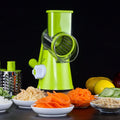 Mandoline vegetable slicer with three stainless steel blades and suction base in blue green, green, or red