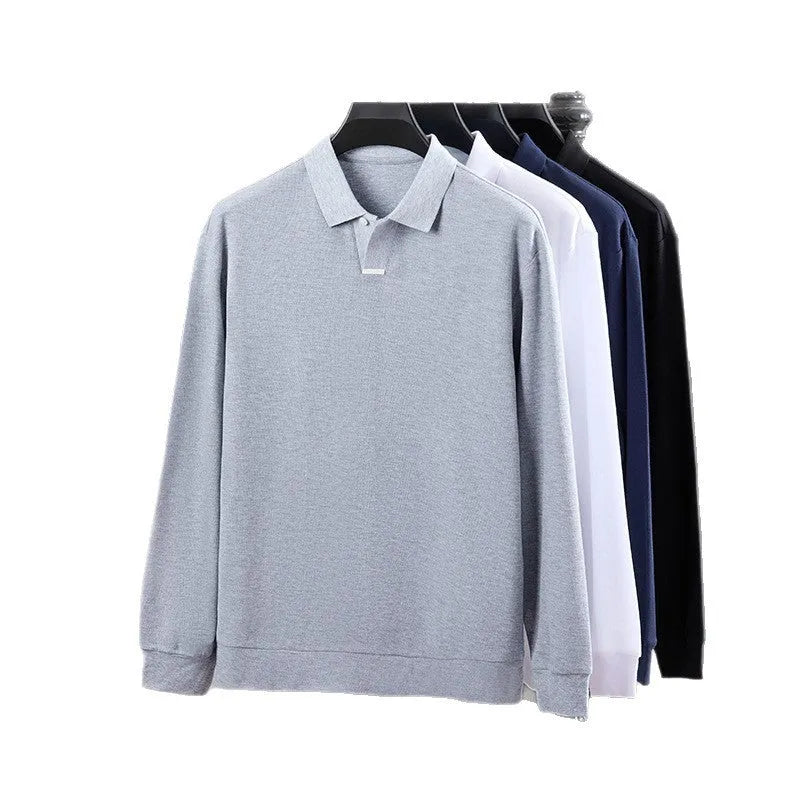 Man wearing a grey loose-fit cotton polo shirt with long sleeves and a collar.