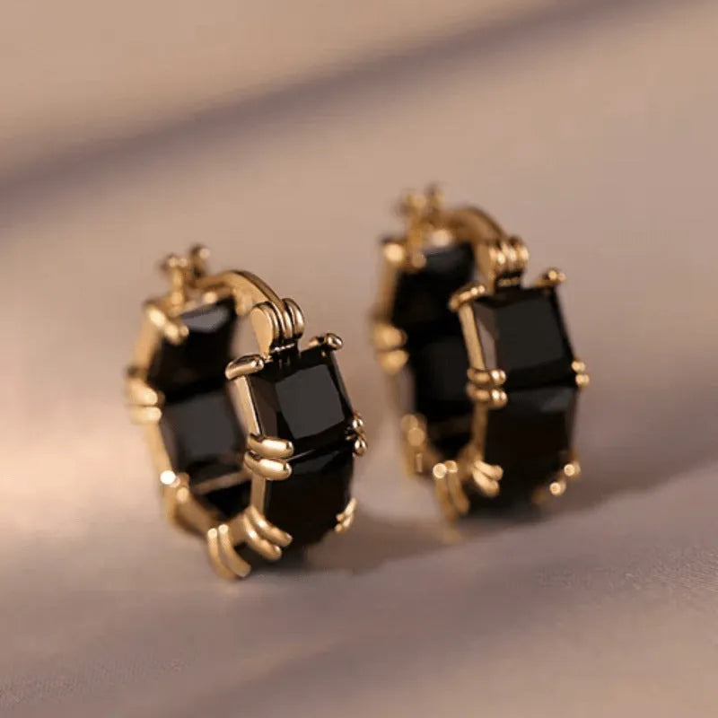 Geometric U-shaped copper earrings with round crystal zirconium accents in gold electroplated finish