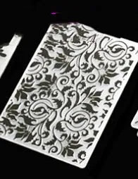 Plastic cake decorating mould showing windmill and flower shapes, folding size 14.5 by 10.5 cm.