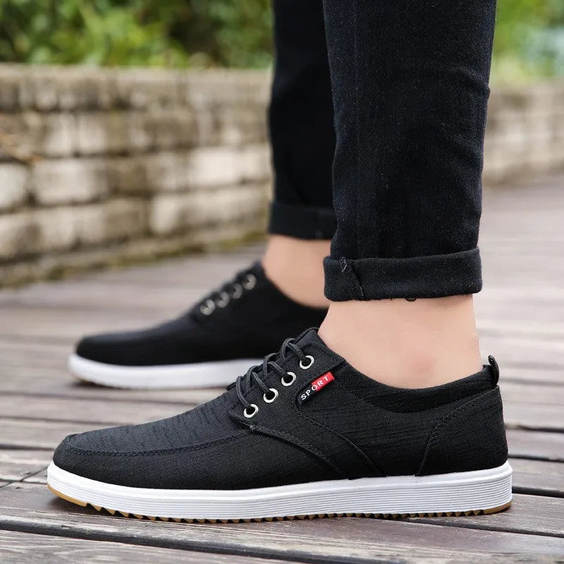 Men's lace-up canvas casual walking shoes in black with flat heel and lace-up design