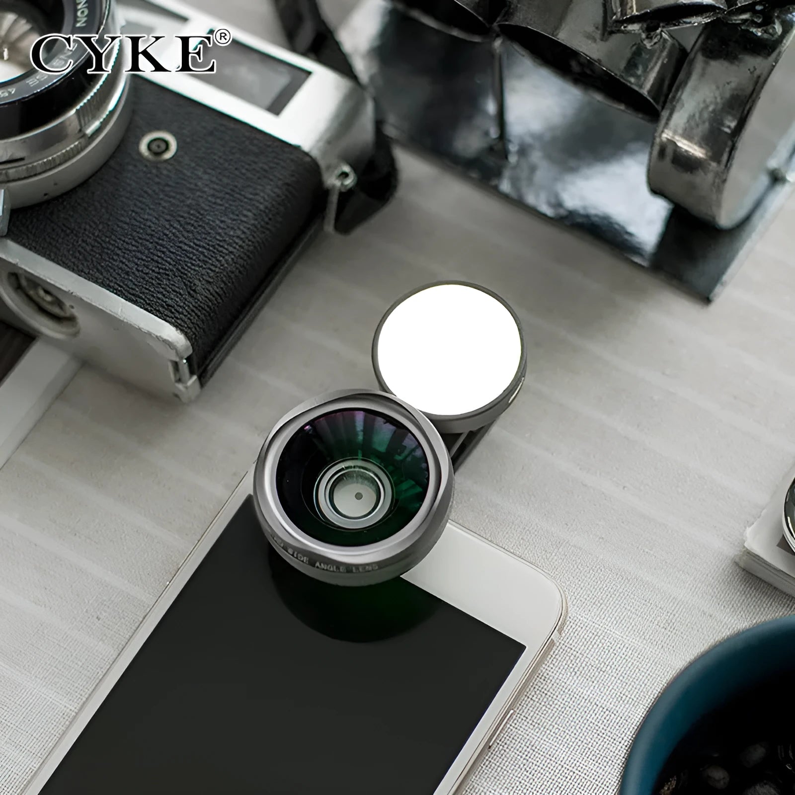 Smartphone wide-angle camera lens attachment with LED light ring in black, red, and silver grey colours.