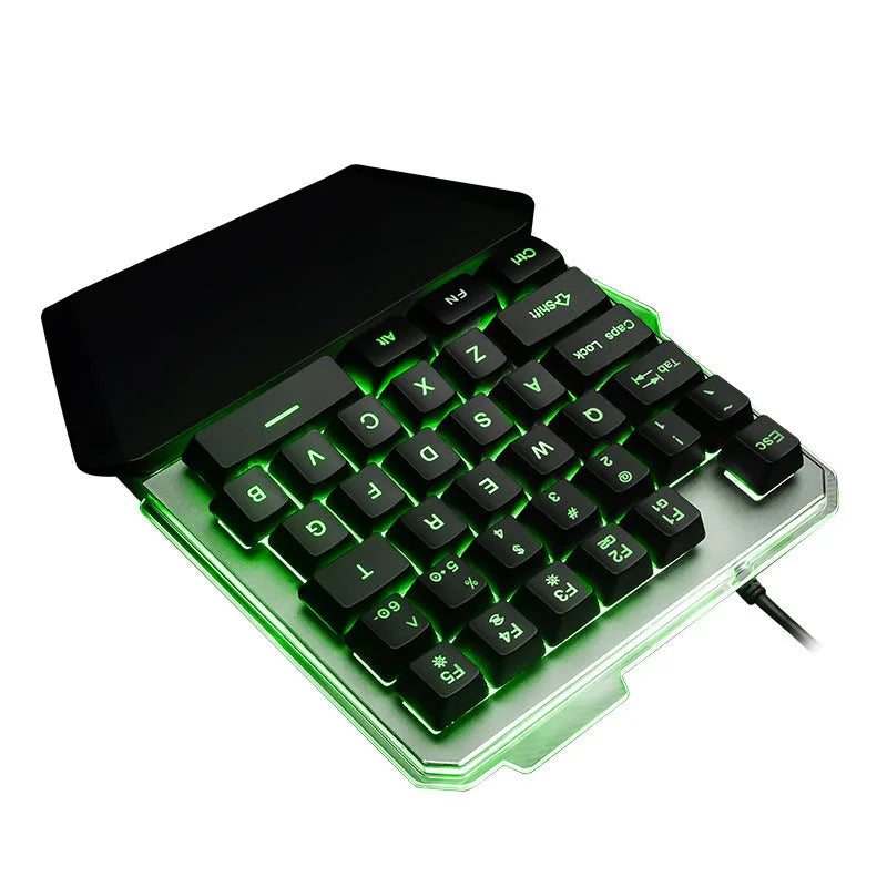 Black G40 Flow one-handed mechanical keyboard with RGB backlit keys on a desk.