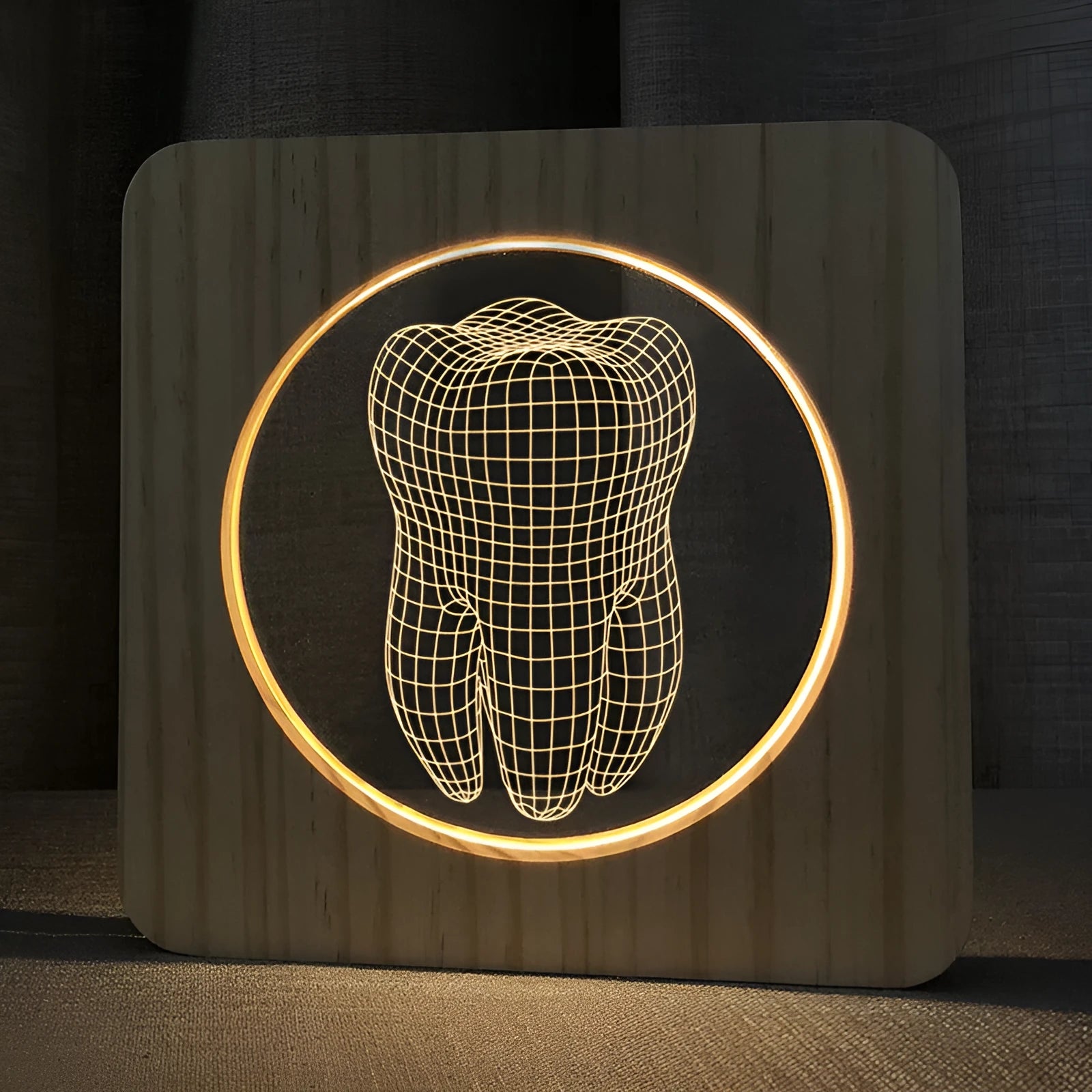 Wood colour tooth shaped acrylic night lamp with USB cable on wooden surface