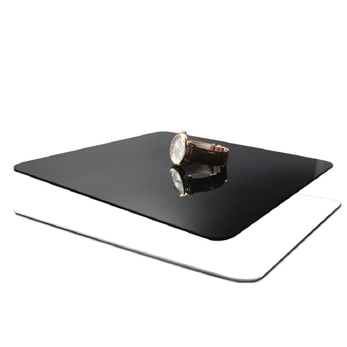 Square black and white acrylic reflection boards for photography in three different sizes.